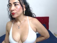 I am a mature Latina who commands attention just by walking into a room. Tall, elegant, with a presence that blends experience and desire with every step. Her skin reflects sweetness and maturity, but also the fire of someone who knows what she wants and how to get it. Her long, shapely legs seem made to be admired, while her confident, deep gaze unveils you without words. She has a measured voice, with that deep, seductive timbre; every gesture I make exudes natural, effortless sensuality. She doesn